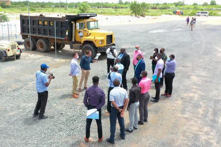 The directors of Superior Concrete (left) in a confrontation with Minister Collin Croal and CH&PA’s Sherwyn Greaves during their impromptu visit to the location (CH&PA photo)