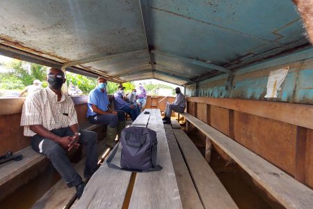 Socially-distanced workers using transport punts 