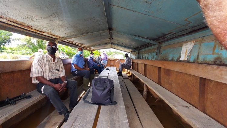 Socially-distanced workers using transport punts 