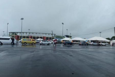 Cars lined up at the second vaccination drive-thru which was held at the National Stadium yesterday (DPI photo)