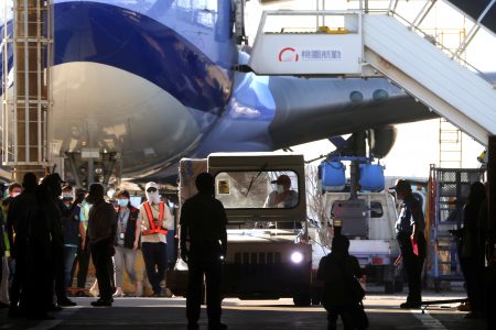 Workers transport Moderna vaccines against the coronavirus disease (COVID-19) to Taiwan Air cargo Terminal in Taoyuan, Taiwan, June 18, 2021. REUTERS/Ann Wang