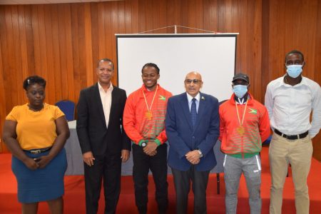 Local based sprinters, Noelex Holder (third from right) and Akeem Stewart (second from right), one-half of the bronze medal winning quartet at the just concluded South America Senior Championships in Ecuador, labelled their achievement as surreal