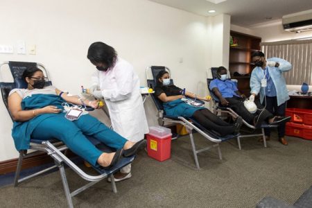 Some of GBTI staffers giving blood at the Water Street branch on Thursday (GBTI photo) 