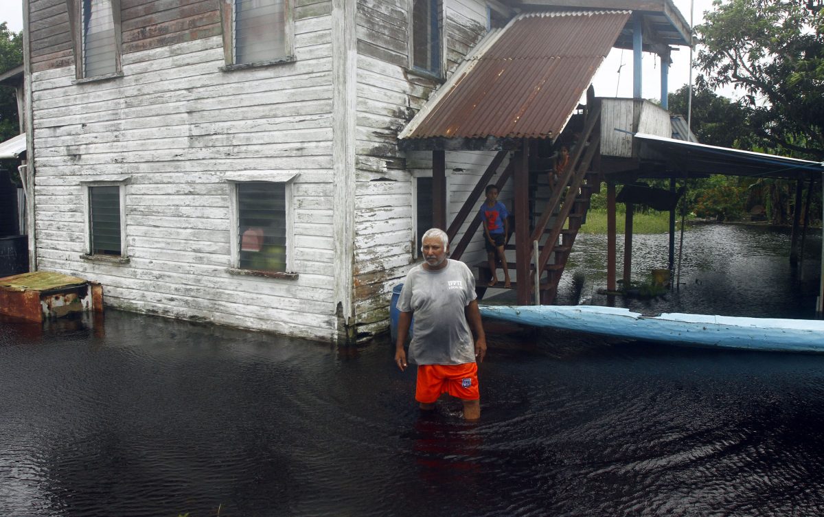A resident of Big Biaboo makes his way through the floodwater (Orlando Charles photo)