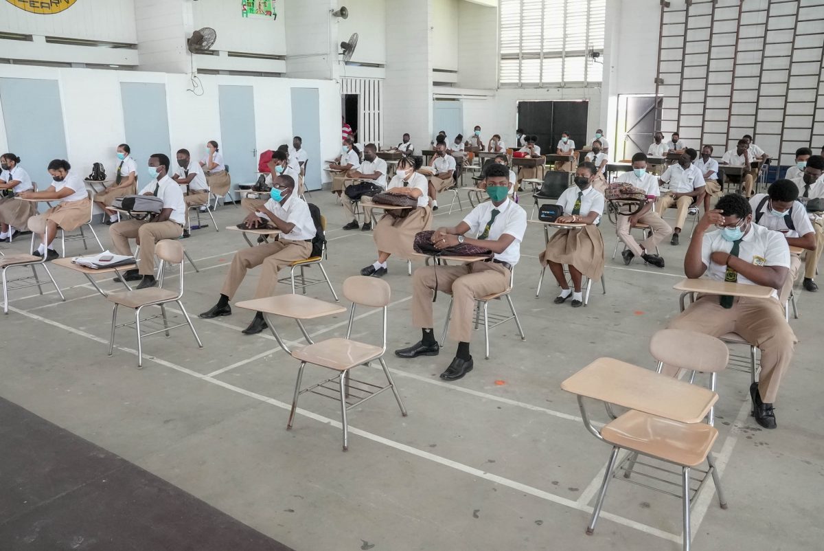 The Fifth form students of North Ruimveldt multilateral secondary school seated in the school’s auditorium during their first assembly since a section of the school was gutted in a fire last Saturday 