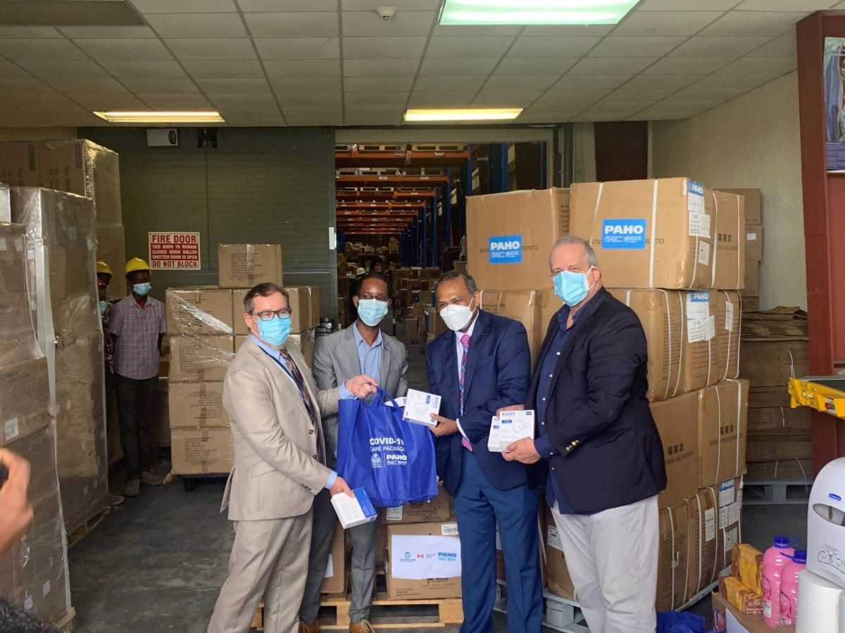 Officials handing over the supplies to the Minister of Health. From left: Canadian High Commissioner Mark Berman, World Bank Representative, Hubert Forrester, Minister of Health, Dr. Frank Anthony and PAHO Representative, Dr Luis Felipe Codina