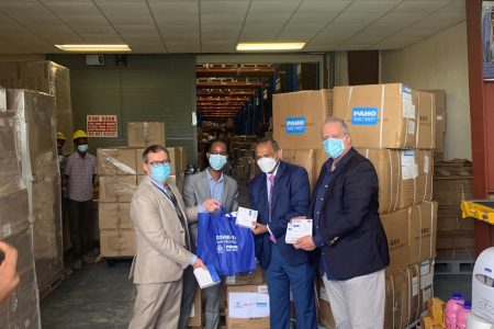 Officials handing over the supplies to the Minister of Health. From left: Canadian High Commissioner Mark Berman, World Bank Representative, Hubert Forrester, Minister of Health, Dr. Frank Anthony and PAHO Representative, Dr Luis Felipe Codina