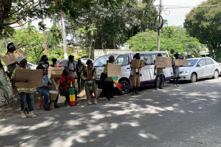Members of the Rastafarian community as they protested outside the Office of the Attorney General 