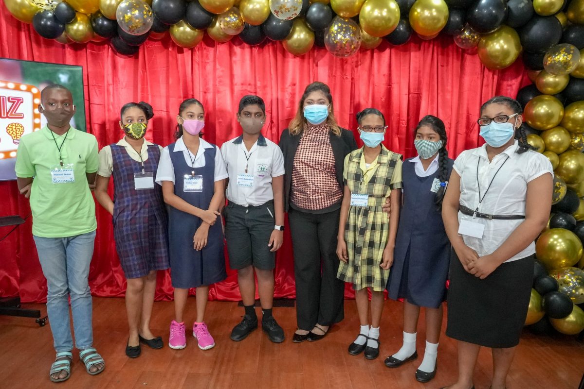 Some of the Guyana Learning Channel’s Whiz Kids game show contestants pose with the Minister of Education, Priya Manickchand during the official launch of the show at NCERD on Friday (Ministry of Education Photo)