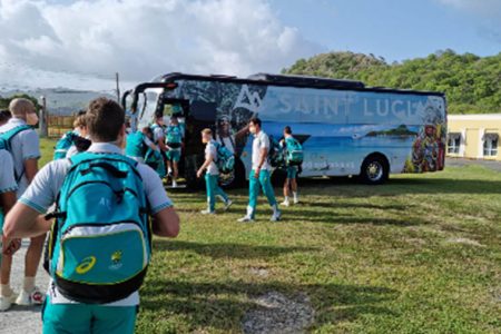 The Australia squad boards the team bus after arriving in St Lucia. 