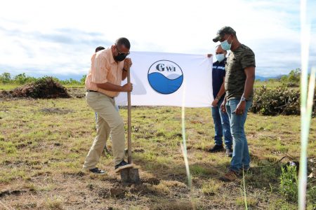 Minister Collin Croal (left) turning the sod (CH&PA photo)