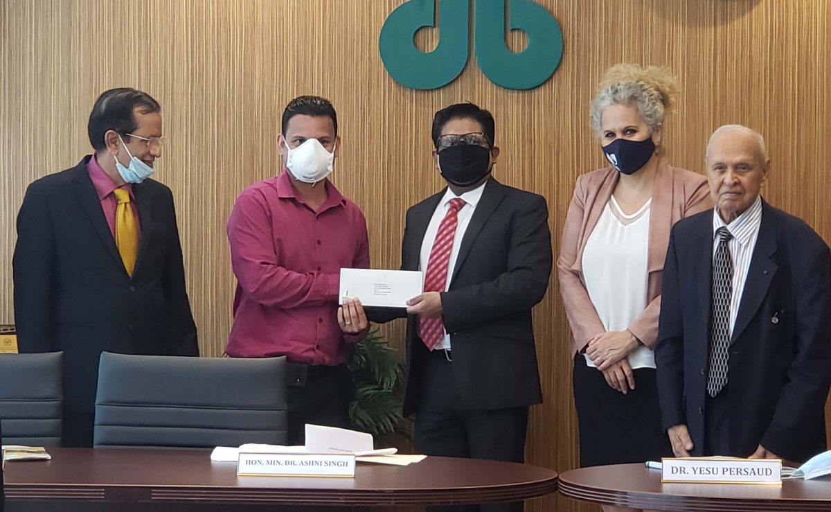From left are Chief Executive Officer of Demerara Bank Pravinchandra Dave, a beneficiary of the TFFP programme, Senior Minister with responsibility for Finance Dr. Ashni Singh, IDB Country Representative Sophie Makonnen and Founder and Chairman of Demerara Bank Dr Yesu Persaud. 