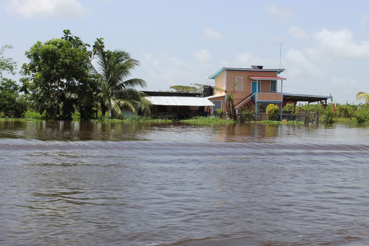 A home in the Abary Creek encircled by high water