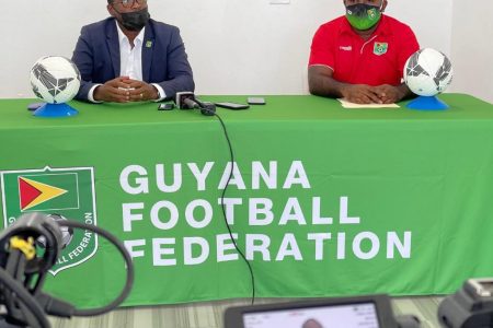 GFF President Wayne Forde (left) addressing the gathering at the National Training Centre in Providence alongside Communication Officer Keeran Williams.
