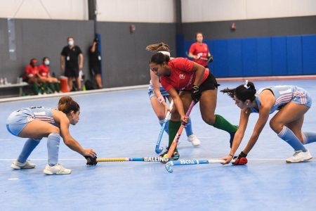 Aaliyah Gordon (centre) of Guyana surrounded by three Argentinian defenders during their group fixture in the Indoor Pan Am Cup (IPAC)