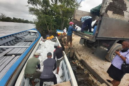 The Regional Democratic Council of Region Two on Friday sent over 1200 food hampers to the Pomeroon River as flood relief. Hampers were prepared and provided by the Civil Defence Commission (CDC). This CDC photo was taken at Charity. 