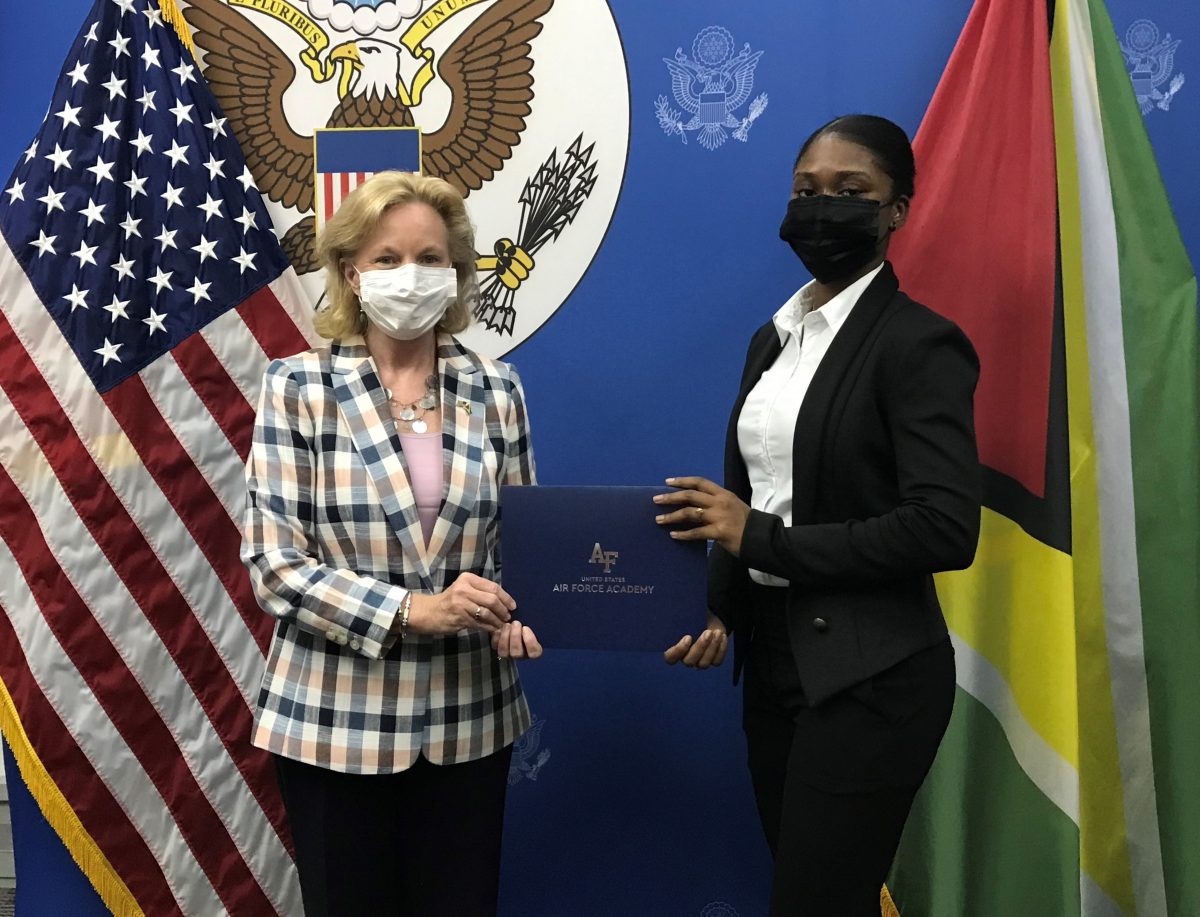 US Ambassador Sarah-Ann Lynch (left) congratulating Emmanuela Desir (US Embassy photo)