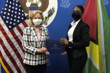 US Ambassador Sarah-Ann Lynch (left) congratulating Emmanuela Desir (US Embassy photo)