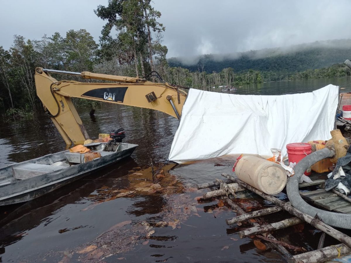 An excavator submerged in floodwaters at Imbaimadai. Due to severe flooding in regions 1, 7, and 8 ravaging mining camps, the Guyana Women Miners Organisation (GWMO) yesterday issued an appeal to government to provide assistance to affected prospectors. 