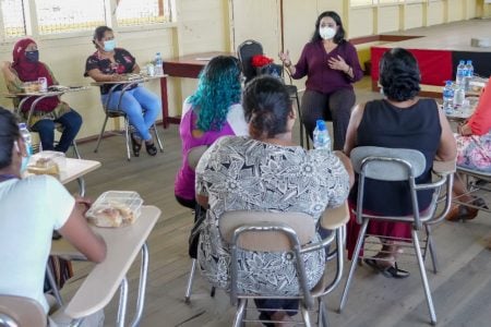 Minister Vindhya Persaud speaking to women at the outreach. (Ministry of Human Services and Social Security photo)