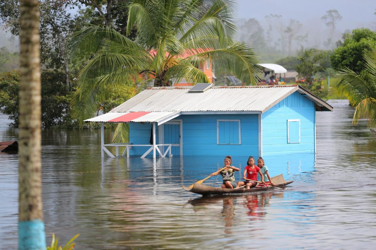 Paddling past a flooded Region Seven home (CDC photo)