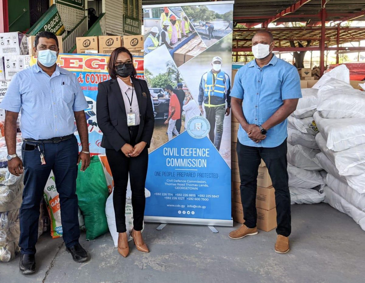 Telesha Ousman (centre) along with Imran Ally (left) and Deputy Director General of the CDC Major Loring Benons at the handing over at the Muslim Youth Organization on Woolford Avenue, Georgetown. (DPI photo)