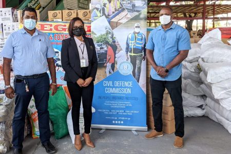 Telesha Ousman (centre) along with Imran Ally (left) and Deputy Director General of the CDC Major Loring Benons at the handing over at the Muslim Youth Organization on Woolford Avenue, Georgetown. (DPI photo)