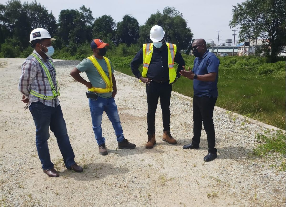 Director of Sport, Steve Ninvalle (right) held discussion with the consultant (second from right) and the engineers on the project yesterday in Berbice. 