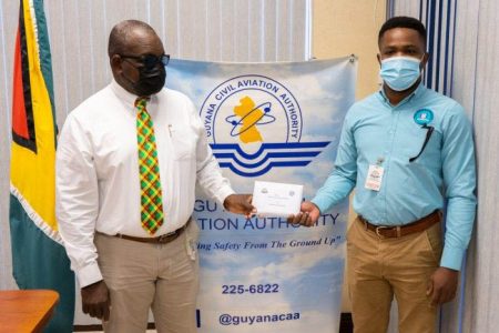  Safety Coordinator, GCAA, Courtney Frank (left) handed over the donation to Public Information Officer, CDC, Patrice Wishart (DPI photo)