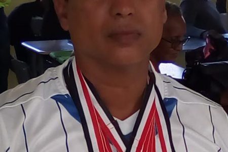 Covid-19 victim Errol Hosein with some of his medals.
