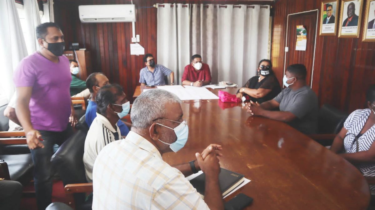  Attorney General Anil Nandlall and Minister of Agriculture, Zulfikar Mustapha (seated at head of table) meeting with farmers 