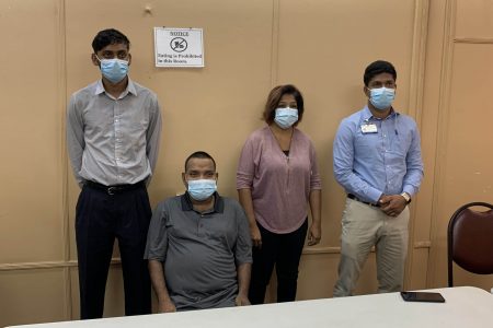 Looknauth Mohammed (seated) along with the team of doctors. From left are Dr Jagnanand Ramnarine, Dr Kamela Bemaul-Sukhu, and Dr Navindranauth Rambaran
