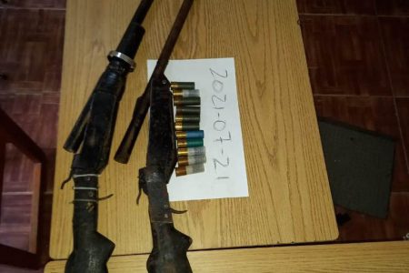 The shotguns and ammunition that were discovered by police