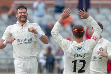 Jimmy Anderson, left, celebrates taking 1000 first class wickets yesterday.