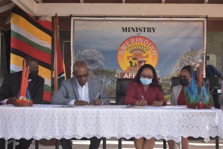 The signing of the MoU between the Ministry of Amerindian Affairs and the Ministry of Labour. From left are Richard Maughn, Joseph Hamilton, Pauline Sukhai, and Sharon Hicks (Photo by Ministry of Amerindian Affairs)