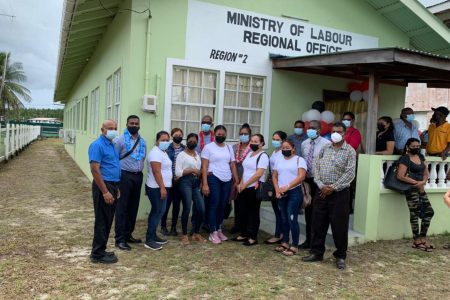 The Minister of Labour posing with the Board of Industrial Training trainees in front of the newly commissioned Ministry of Labour Office at Anna Regina, Pomeroon-Supenaam (Region Two)