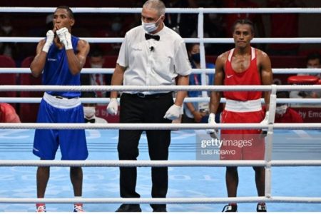 Guyana’s Keevin Allicock appears dejected following his unanimous decision defeat to Alexy Miguel De La Cruz Baez of the Dominican Republic yesterday in their men’s featherweight (52-57 kg) bout.