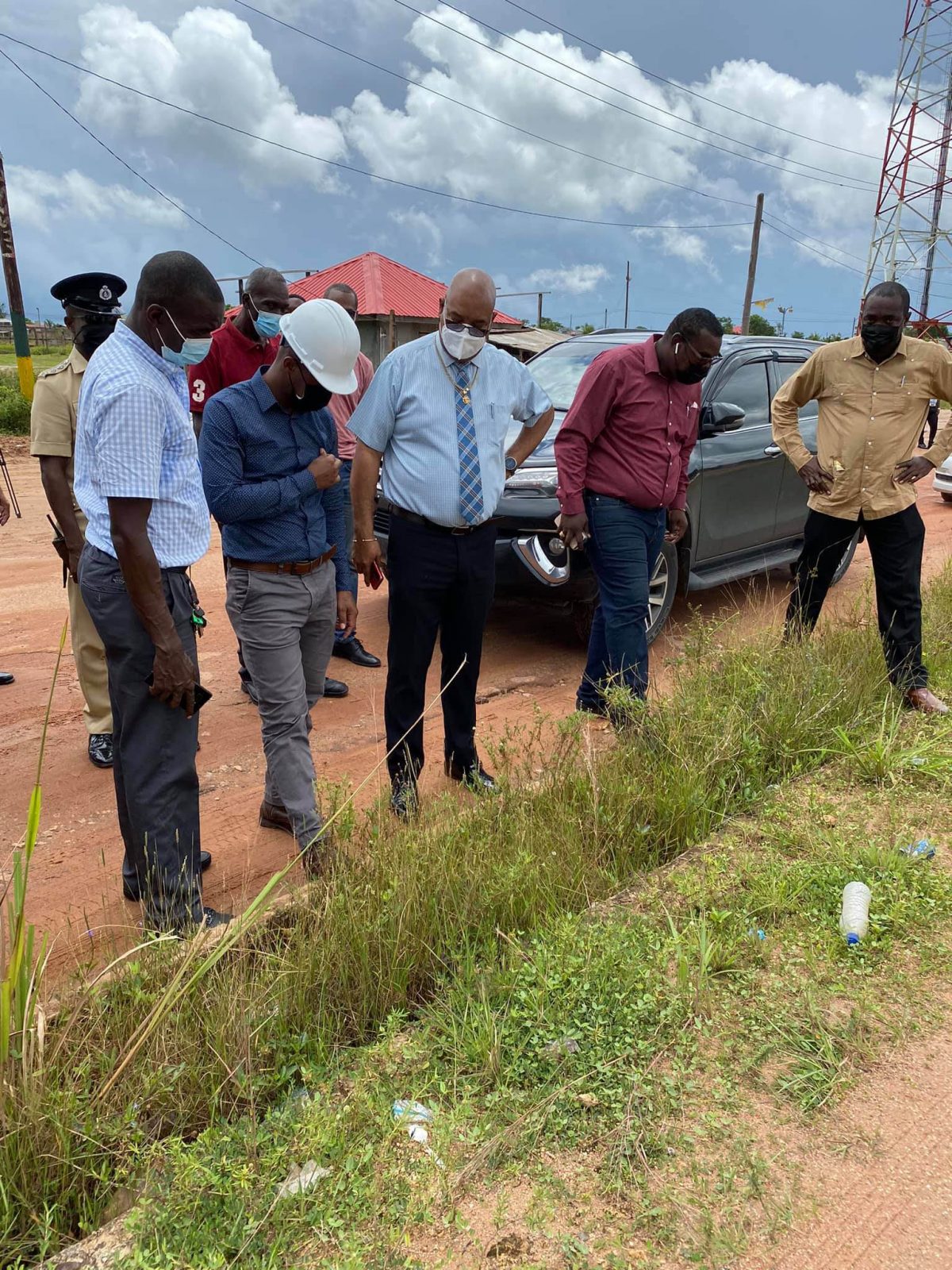 Minister of Public Works Juan Edghill (third from left) inspecting the Block 22 Main Access Road in Linden, Region 10 yesterday. (Ministry of Public Works photo)