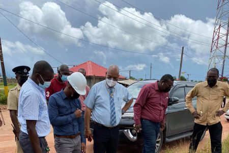 Minister of Public Works Juan Edghill (third from left) inspecting the Block 22 Main Access Road in Linden, Region 10 yesterday. (Ministry of Public Works photo)