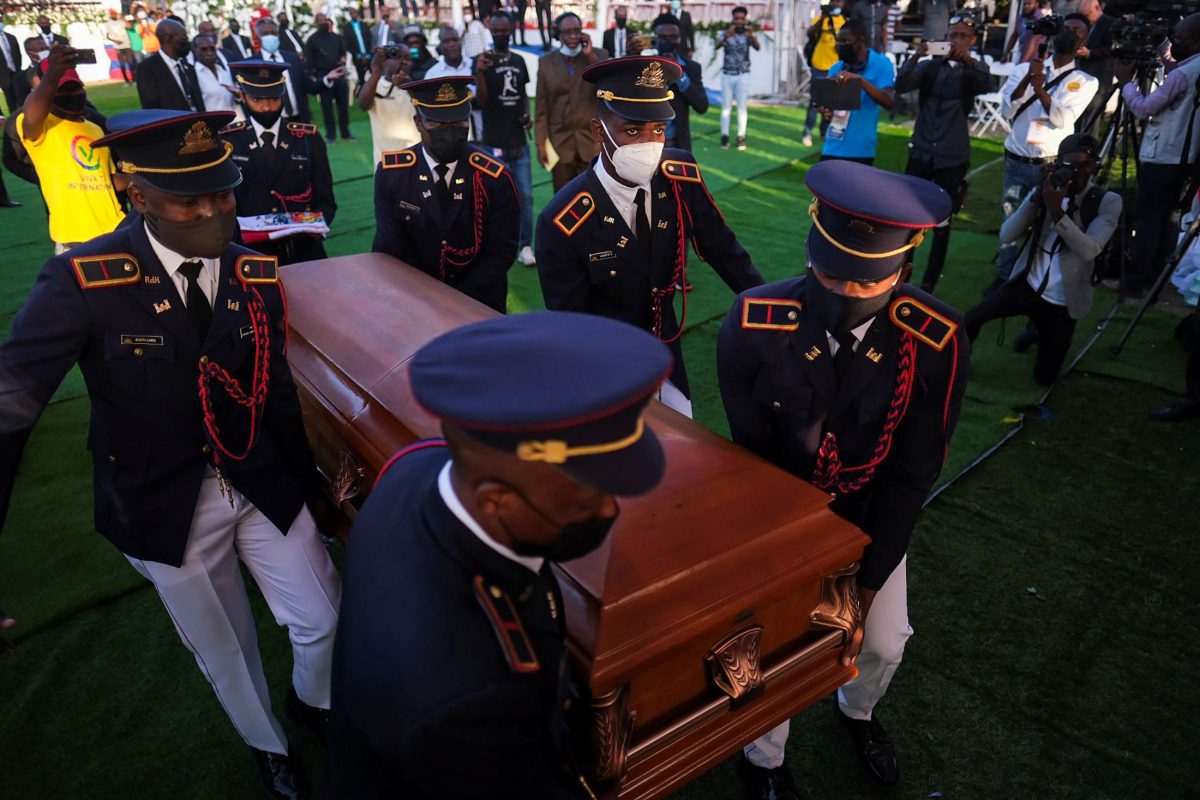 Pallbearers in military attire carry the coffin holding the body of late Haitian President Jovenel Moise after he was shot dead at his home in Port-au-Prince earlier this month, in Cap-Haitien, July 23, 2021. REUTERS/Ricardo Arduengo