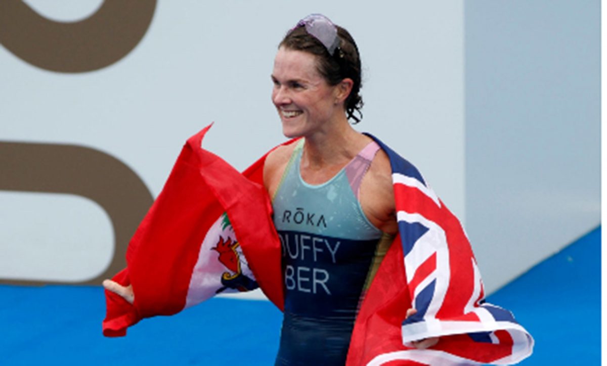 Bermudian Flora Duffy celebrates with the country’s flag after winning gold in Tokyo. 