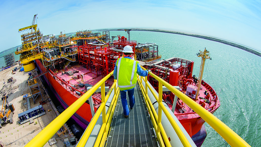 A worker approaches one of the MWCC's rapid-response vessels that can be deployed to capture, process, store and offload liquids during a subsea incident. (ExxonMobil photo)