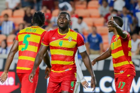 Grenada players protest a refereeing decision against Honduras.
