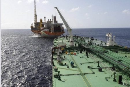 The Greece-flagged tanker in the foreground during the lifting operation  (Twitter post from India in Guyana)