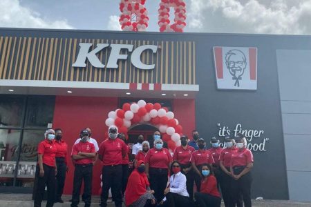 Staff outside the newest KFC restaurant at Xtra Plaza, Sangre Grande. The restaurant was opened yesterday