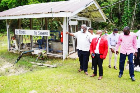 Prime Minister Mark Phillips (left) during the visit to one of the installations. (Photo from Facebook page of Prime Minister Mark Phillips)