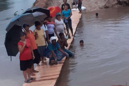 The residents standing on their bridge (Region 10 photo)