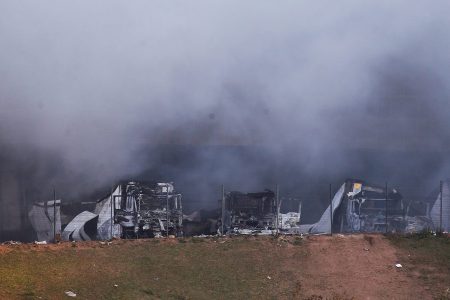 Smoke rises from burning trucks after violence erupted following the jailing of former South African President Jacob Zuma, in Hillcrest, South Africa, July 14, 2021. Photo: Reuters/Rogan Ward