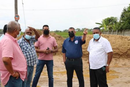 Minister Collin Croal (second from right), inspects ongoing works at Fort Ordnance, along with regional officials.  (Ministry of Housing photo)