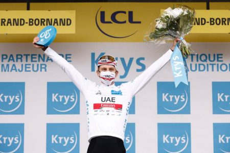 UAE Team Emirates rider Tadej Pogacar of Slovenia celebrates on the podium wearing the white jersey REUTERS/Stephane Mahe